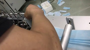 Loading of nose strip of face mask machine