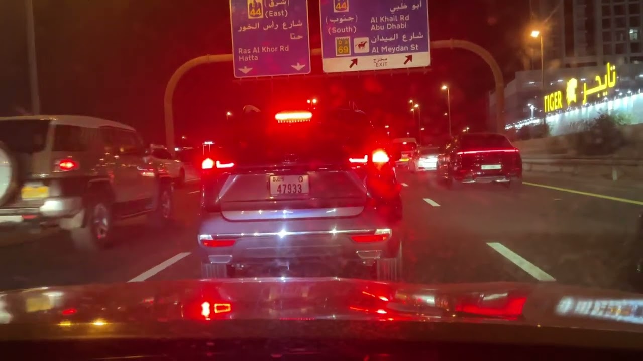 Driving at Dubai at night,busy nightlife and downtown Dubai 