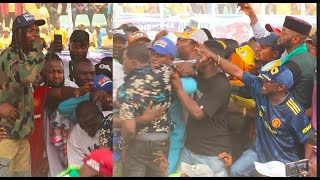 Moment Agege Boys Storm Stage To Fight While Naira Marley Was Singing For Bola Ahmed Tinubu On Stage