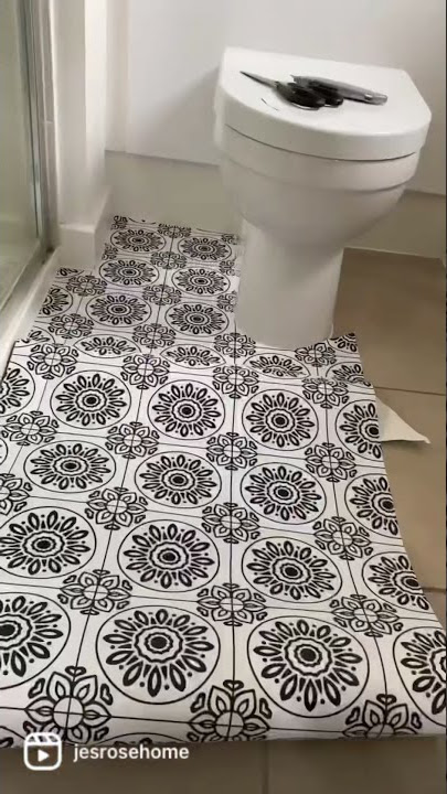 Applying vinyl to a bathroom floor