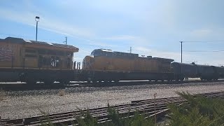 A Repainted Ex-Cnw Ac44 Trails On A Manifest