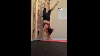Woman Falls On Her Face While She Practices Handstands At Home