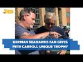 German seahawks super fan presents pete carroll with unique trophy