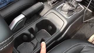 Jeep Wrangler JL mystery slot by cup holders explained 