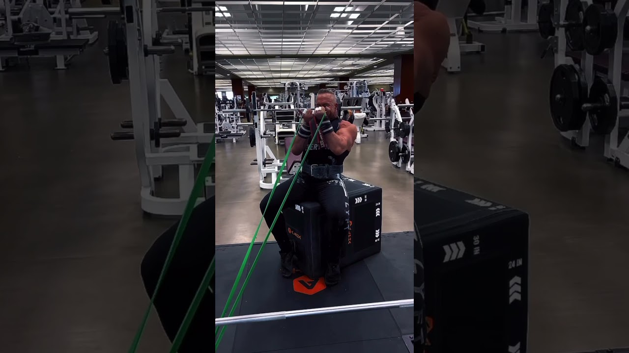 Leaning seated resistance band curls with your upper arm in line with the angle of the resistance