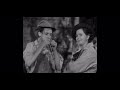 Robert mcclung playing the harmonica  pigskin parade 1936