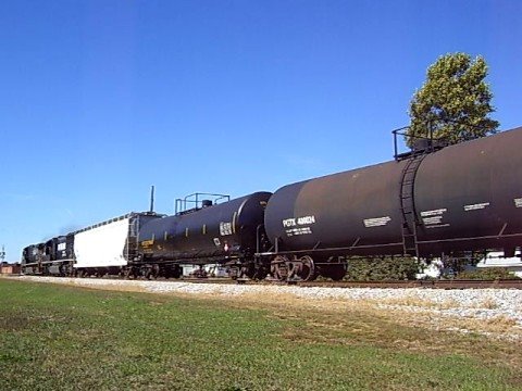 NS C40-9 #8830 crosses Independence Street in Tipton, Indiana. Engines include: NS 8830 (C40-9) NS 2509 (SD70)