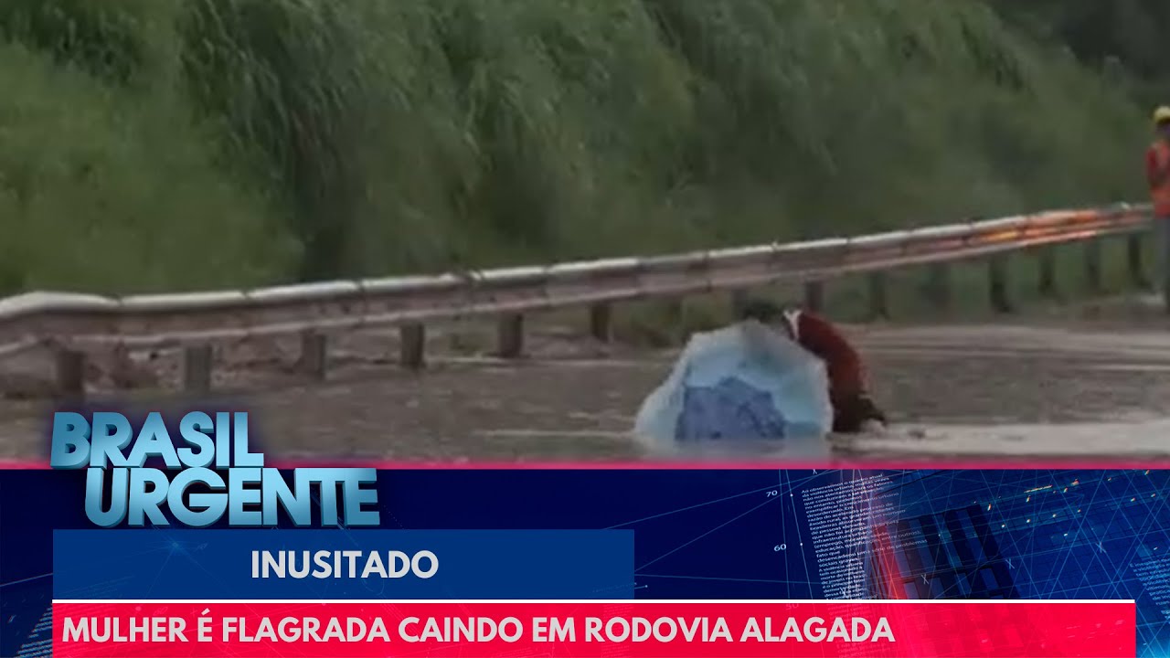 Mulher cai em rodovia alagada | Brasil Urgente