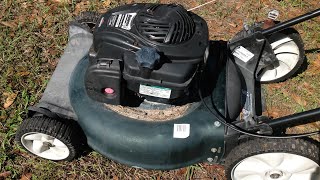 Bolens walk behind mower from the side of the road.