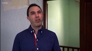 Auctioneer Andrew Binstock on homes under the hammer. Brushing his hair in the mirror