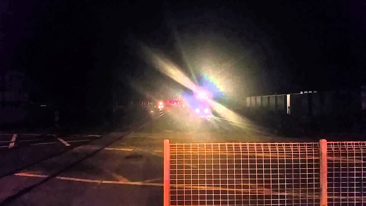 Queensland Rail EMU passing through Sherwood level crossing.