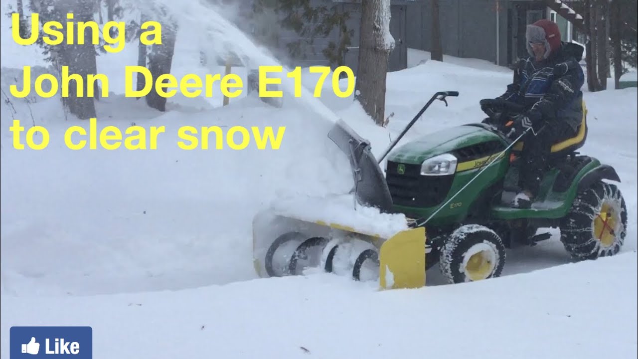 John Deere E170 lawn tractor with a snowblower attachment see it in action in a heavy snowfall