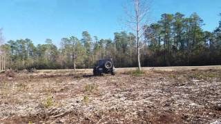 Jeep Rubicon wheeling in a field