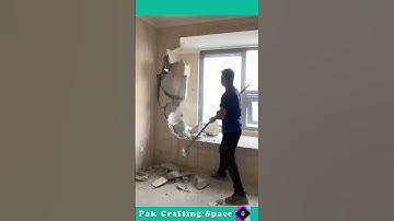 The Process Of Breaking A Wall With A Hammer