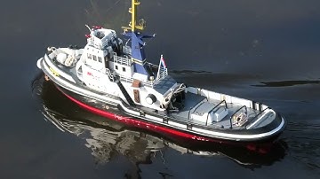 Nicely made RC tug has a run on the pond