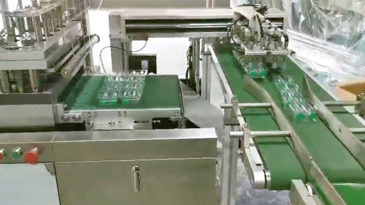 Ampoules bottles blister packing machine with automated robot pickup ...