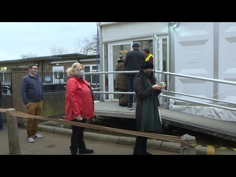 Londoners receive Covid jabs as UK ramps up booster vaccine programme | AFP - AFP News Agency