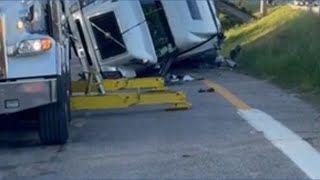 Overturned semi pulled upright