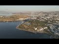D-Log M. Bodrum, Turkey. Aerial drone view of forested hill with Tiger Tower in bright warm sunli...