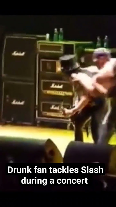 Drunk moron tackles Slash during a concert #music #gunsnroses #shorts