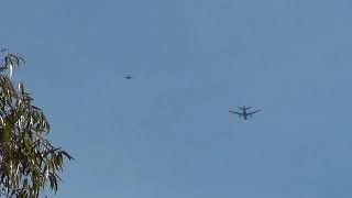 US Navy F-18 Hornets Escort KC-111 tanker over mountain top home