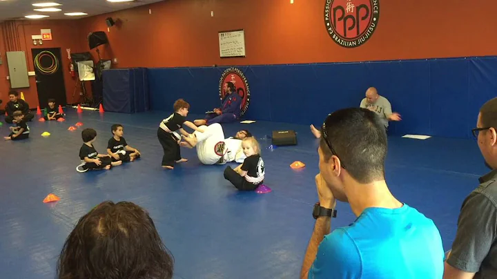 Parker earns his single orange stripe belt at Jiu-...