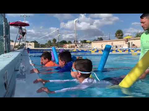 learning how to put the face underwater is one if the first skills in ...
