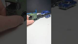 Massdi Scania in matte olive with a black trailer loaded with THW MB Truck + THW Unimog #164scale