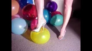 Popping balloons wearing VERY High  Heels