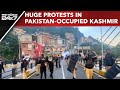 Pok protests news  huge protests clashes with cops in pakistanoccupied kashmir