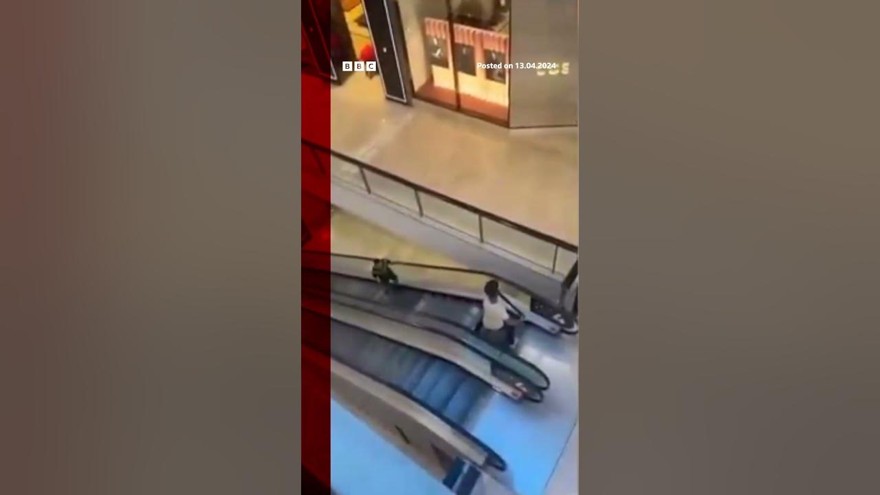 A civilian was filmed confronting the Sydney knifeman on the mall escalators. #Shorts #BBCNews