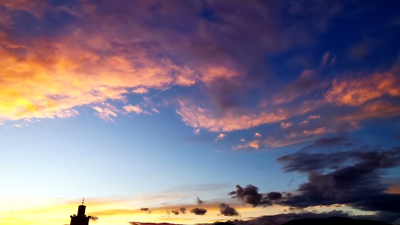 Colorful Clouds . Rainbow Colors. Sunset View. 4K Time Lapse