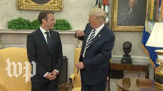 Trump brushes 'dandruff' off Macron