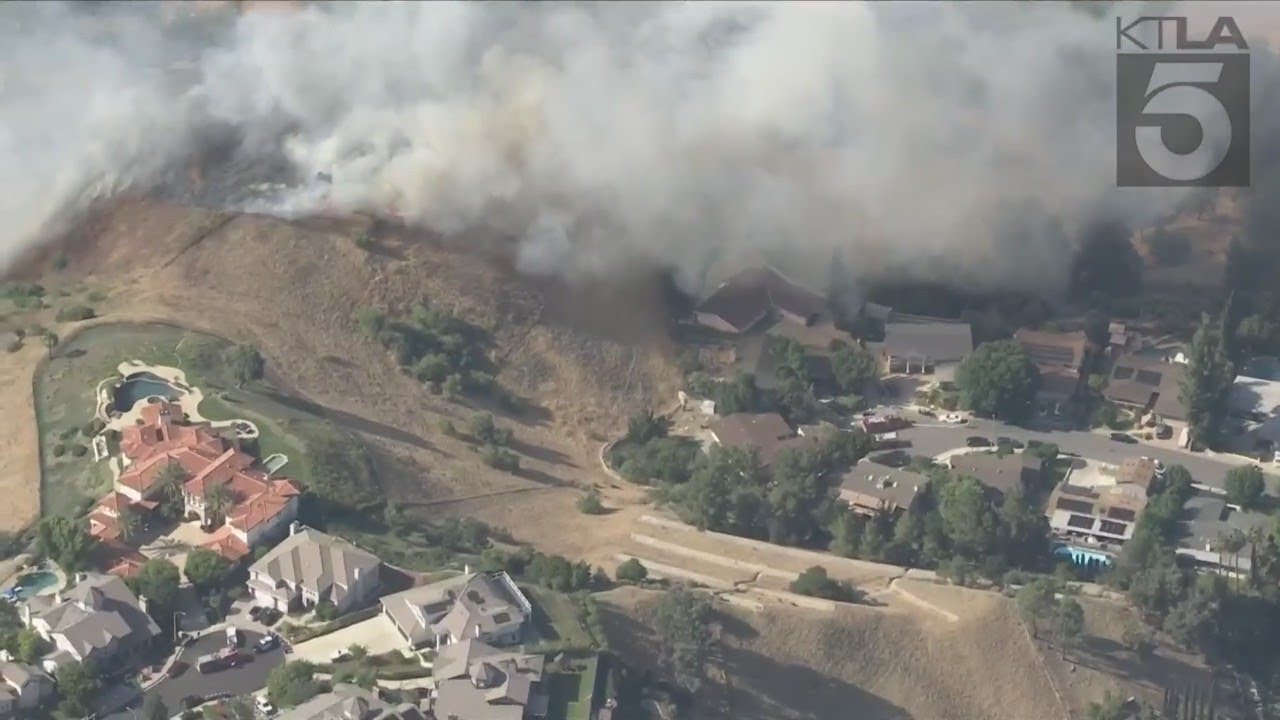 Brush fire threatens home in Los Angeles County - YouTube