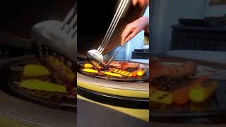 Kamado grilling baked potatoes, sausages &amp; vegetables #shorts.  #Shorts