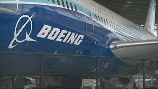 Boeing to cut staff, slow production