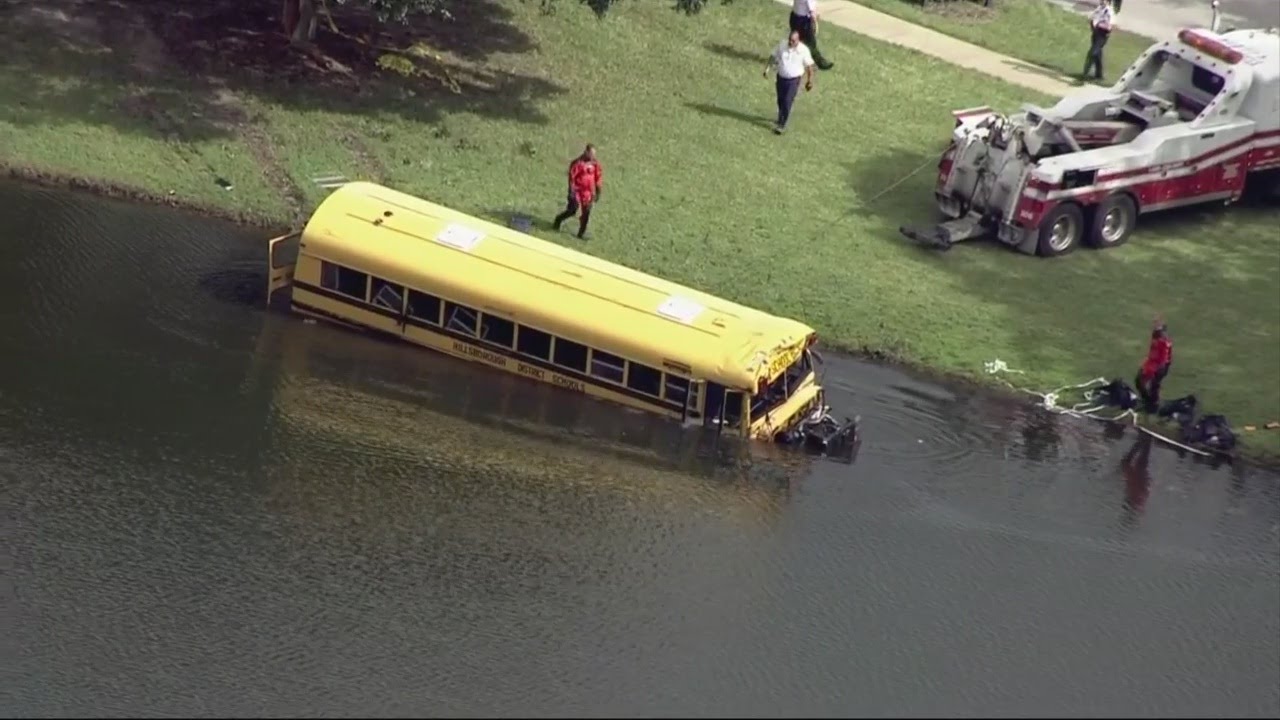 Hillsborough school bus crashes in pond - YouTube