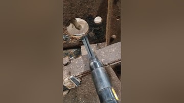 Using needle scaler to clean frame.