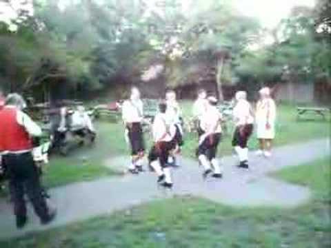 The Chingford Morrismen dance out at The Sirloin pub, Chingford, London, England.