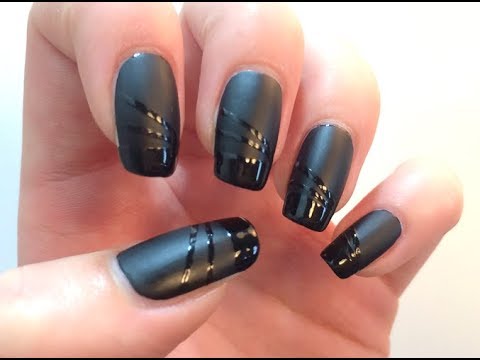 Black shiny and matte nail design with black sugar nail art. 