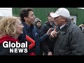 Volunteer berates trudeau accusing him of delaying sandbag work