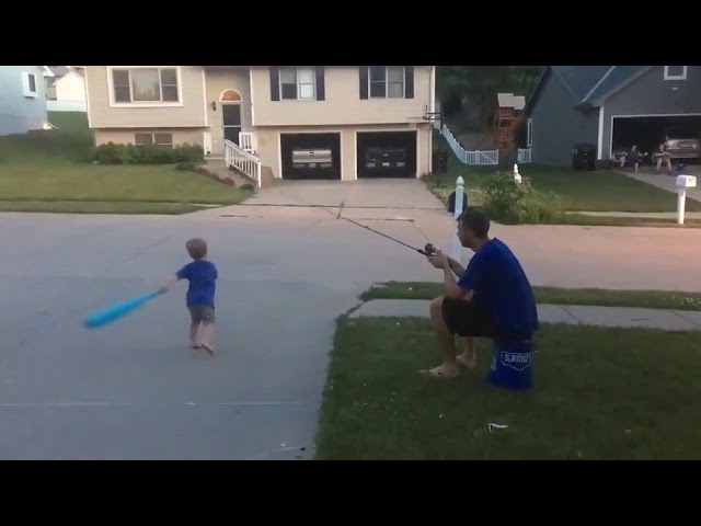 dad uses fishing pole for batting practice Dad Uses Fishing Rod to Teach Son How to Hit a Baseball