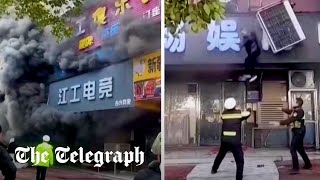 video: Watch: Moment people jump from windows to escape shop fire in China