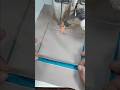 Sewing cargo pockets with a multi-function sliding sewing foot