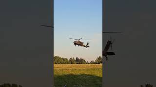 Boeing AH-64 Apache doing in-flight training in the evening