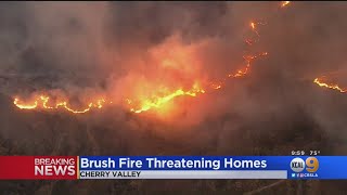 A large brush fire blackened approximately 700 acres and threatened
homes friday in cherry valley, prompting the evacuation of nearly
1,000 residents.