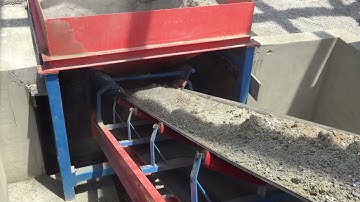 Conmach BlockKing-36MS Concrete Block Moulding Machine during loading materials to conveyor bucket