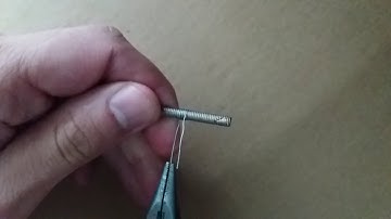 Spaced coil on a screw