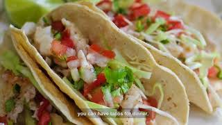In Good Taste: Korean Tacos with Rachael Chen
In our new food diplomacy video series, we introduce Korean tacos, which have grown in popularity from California to Texas and beyond through food trucks.
During her stay in Singapore, American diplomat Rachael Chen prepared the dish and shared the recipe with Singaporean chef Kiran Charles as they exchanged ideas on immigrants’ influence on food in the U.S. and Singapore. What American or Singaporean fusion dishes have you tried? #TastyTuesday
RECIPE
Korean Tacos by Rachael Chen
Napa Cabbage Kim Chi:
1 small head of napa cabbage
2 tbsp salt
1-2 tsp sugar
1-2 tsp fish sauce or soy sauce
2-3 tbsp gochujiang
1 tbsp minced garlic
1 tbsp minced fresh ginger
2-3 green onions, cut into 1-inch lengths
1-2 carrots, julienned
Separate and wash the cabbage leaves. Cut into 2-inch pieces. Mix with salt in a large bowl, ensuring that the salt is spread across all the leaves. Refrigerate overnight in a covered, non-reactive bowl, or for at least 8 hours.
Drain the water that seeped out of the cabbage overnight. Toss in the green onions and carrots. Add the sugar, fish or soy sauce, gochujiang, garlic, and ginger. Thoroughly mix everything so that all the vegetables are covered uniformly in the sauce. Place in a covered container, preferable an air-tight glass jar, and let it sit on the counter for a few days. Be sure to “burp” or open the container once a day to release gases. Test the kim chi—once it’s reached your preferred level of funkiness, it’s ready. Keep in the fridge, where the fermentation will continue, but much slower.
Tortillas:
2 cups of all-purpose flour
Pinch of salt
½ tsp baking powder
2 tbsp butter
½ cup hot water
Mix the flour, salt and baking powder in a large bowl. Cut the butter into small pieces and drop into the flour mixture. Using a fork, press the butter into the flour mixture until the butter is all worked in and the mix looks a bit like sand. Add the hot water a little at a time, mixing until you have a solid, but slightly sticky dough. Divide the dough into about 10 pieces and use your hands to roll each piece into a ball. Using a flat, clean, floured surface, roll each ball into a flat circle with a rolling pin. Be sure to use enough flour so that the dough doesn’t stick to your surface or your rolling pin.
Heat a pan big enough to fit one tortilla. One at a time, place rolled dough into the pan. The tortilla will start to puff a bit—using a spatula, flip the tortilla. Cook until each side has brown parts, but is not black at all. As they come off of the pan, stack the tortillas in a foil packet, which will soften and keep them warm.
Pork:
8-lb pork shoulder (or “Boston Butt”), preferably bone-in, with a nice layer of fat on one side
½ cup salt
½ cup sugar
Place the pork in a bowl. Mix the sugar and salt, and then coat the pork with the sugar-salt mix. Be sure to cover the entire cut of pork. Cover and refrigerate overnight or at least for 8 hours.
Pre-heat oven to 300 degrees F/150C. Brush off excess salt/sugar, drain the juices and place the pork in a roasting pan, fat-side up. Bake for 6 hours at 300F/150C, basting once every hour. For best results, bake covered for first 4 hours, uncovered last 2. Pork should reach an internal temp of 160F/75C and be fork-tender. Let pork sit at room-temp for at least 30 minutes before serving.
Assembly:
Place a bit of pork, kim chi, and gochujiang in a tortilla. Top with fresh coriander leaves and a squeeze a bit of fresh lime. Enjoy. In Good Taste: Korean Tacos with Rachael Chen