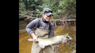 Woman fights and lands a Big King Salmon on a fly rod